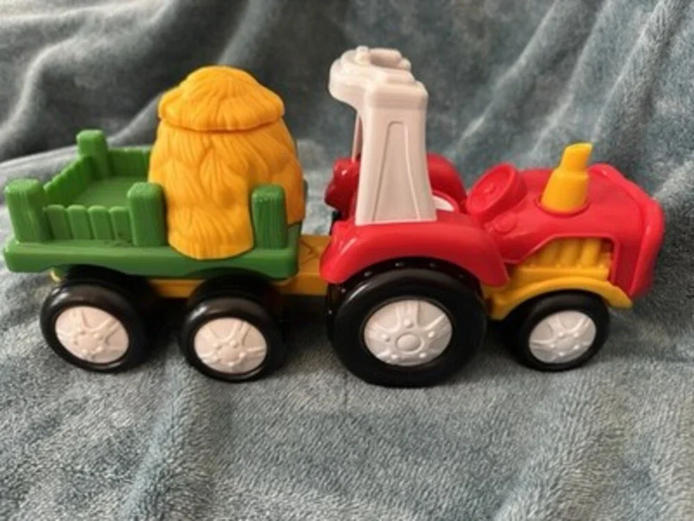 This 2007 Fisher-Price Little People Tow 'n Pull Tractor